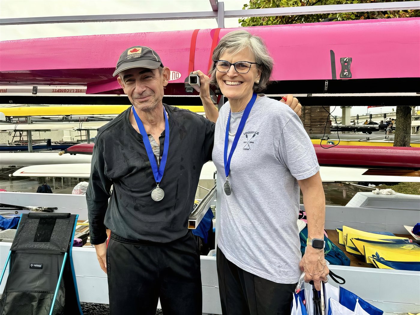 Louisville Rowing Club masters rowers with medals at a regatta